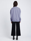 Back image of model in Ring Tie Dye Sweatshirt in Lilac/Off White