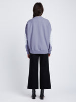 Back image of model in Ring Tie Dye Sweatshirt in Lilac/Off White