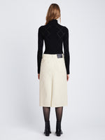 Back full length image of model wearing Denim Midi Skirt in PARCHMENT