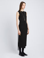 Side full length image of model wearing T-Shirt Wrap Dress in BLACK