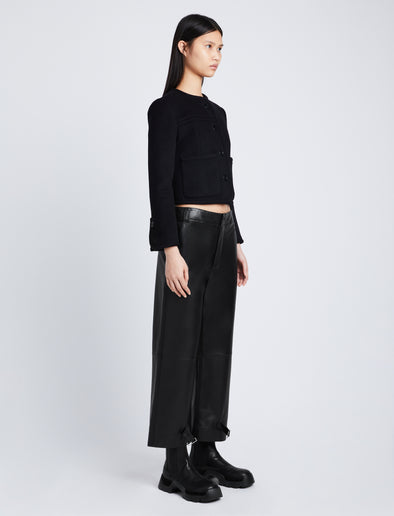 Side full length image of model wearing Kay Leather Pant in BLACK