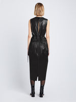 Back full length image of model wearing Faux Leather Drawstring Dress in BLACK
