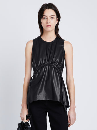 Front cropped image of model wearing Faux Leather Drawstring Top in BLACK
