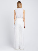 Back full length image of model wearing Faux Leather Drawstring Top in OFF WHITE