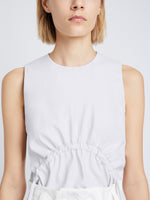 Detail image of model wearing Faux Leather Drawstring Top in OFF WHITE