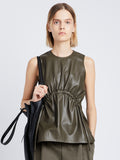 Front cropped image of model wearing Faux Leather Drawstring Top in WOOD