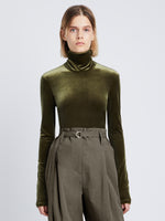 Front cropped image of model wearing Stretch Velvet Turtleneck Top in MILITARY