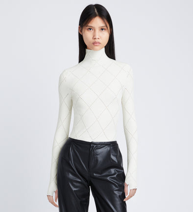 Front cropped image of model wearing Pointelle Diamonds Turtleneck Top in OFF WHITE