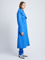 Side image of model wearing Double Face Llama Wool Coat in AZURE