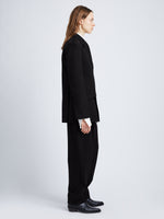 Side full length image of model wearing Wool Stretch Suiting Jacket in BLACK