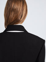 Detail image of model wearing Wool Stretch Suiting Jacket in BLACK