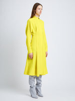 Side full length image of model wearing Crushed Matte Satin Dress in YELLOW