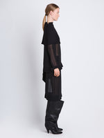 Side full length image of model wearing Technical Chiffon Top in BLACK