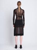 Back full length image of model wearing Technical Chiffon Skirt in BLACK