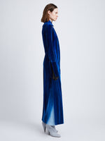 Side full length image of model wearing Ice Dyed Velvet Shirt Dress in COBALT