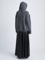 Back full length image of model wearing Technical Boucle Knit Hoodie in GREY