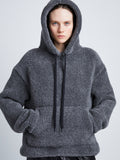 Detail image of model wearing Technical Boucle Knit Hoodie in GREY