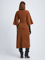 Back full length image of model wearing Viscose Wool Knit Dress in UMBER