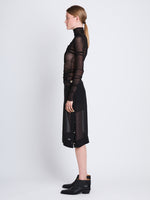 Side full length image of model wearing Viscose Gauze Knit Top in BLACK