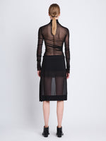 Back full length image of model wearing Viscose Gauze Knit Top in BLACK