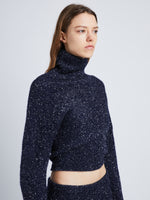 Detail image of model wearing Technical Sequin Sweater in NAVY