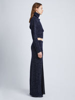 Side full length image of model wearing Technical Sequin Knit Skirt in NAVY
