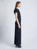Side full length image of model wearing Technical Sequin Knit Dress in NAVY