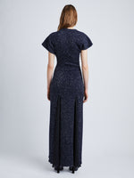 Back full length image of model wearing Technical Sequin Knit Dress in NAVY