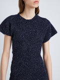 Detail image of model wearing Technical Sequin Knit Dress in NAVY