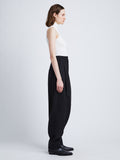 Side full length image of model wearing Wool Stretch Suiting Trousers in BLACK