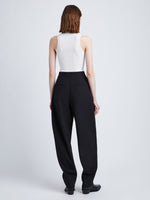 Back full length image of model wearing Wool Stretch Suiting Trousers in BLACK