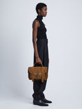 Image of model wearing Suede PS1 Medium Bag in WALNUT