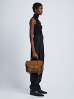 Image of model wearing Suede PS1 Medium Bag in WALNUT