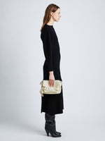 Image of model wearing Beacon Saddle Bag in ECRU