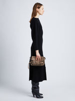 Image of model wearing Beacon Saddle Bag in MUSHROOM