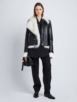 Front image of model in Leather Shearling Motorcycle Jacket in black