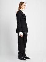 Side full length image of model wearing Wool Twill Jacket in BLACK