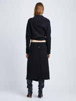 Back full length image of model wearing Wool Twill Skirt in BLACK