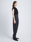 Side full length image of model wearing Melange Wool Trousers in GREY MELANGE