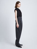 Side full length image of model wearing Melange Wool Trousers in GREY MELANGE
