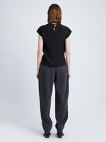 Back full length image of model wearing Melange Wool Trousers in GREY MELANGE