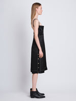Side full length image of model wearing Crushed Shiny Satin Dress in BLACK