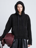 Front cropped image of model wearing Technical Boucle Knit Hoodie in CHARCOAL