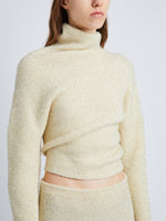 Detail image of model wearing Technical Sequin Sweater in ECRU