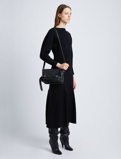 Image of model wearing Beacon Saddle Bag in BLACK