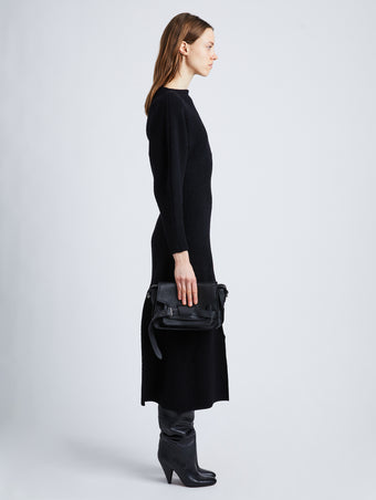 Image of model wearing Beacon Saddle Bag in BLACK