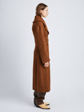 Side image of model wearing Double Face Llama Wool Coat in UMBER