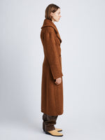 Side image of model wearing Double Face Llama Wool Coat in UMBER