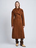 Front image of model wearing Double Face Llama Wool Coat in UMBER with buttons clasped