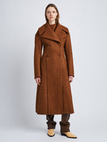 Front image of model wearing Double Face Llama Wool Coat in UMBER with buttons clasped